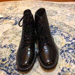 Shiny black combat boots